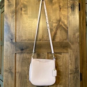 Kate Spade Crossbody bag in a soft pedal pink with silver hardware.